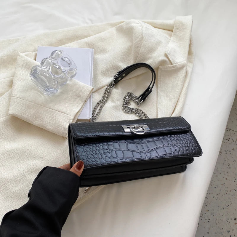 LunaStone mini shoulder bag with stone pattern and chain accents