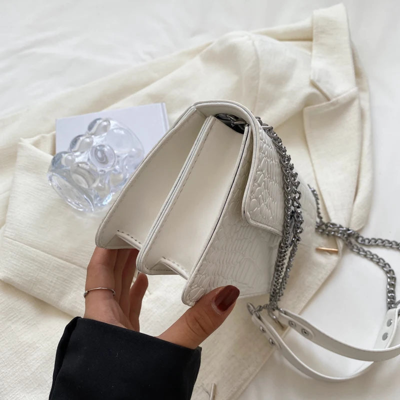 LunaStone mini shoulder bag with stone pattern and chain accents