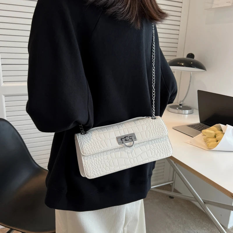 LunaStone mini shoulder bag with stone pattern and chain accents