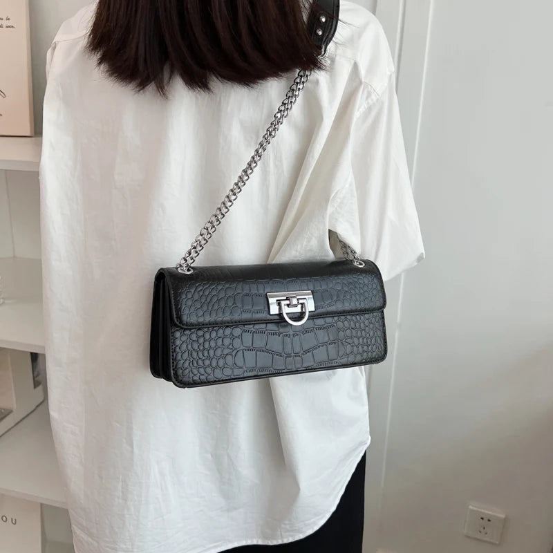 LunaStone mini shoulder bag with stone pattern and chain accents