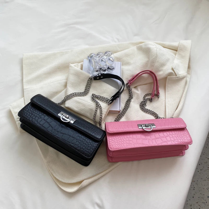 LunaStone mini shoulder bag with stone pattern and chain accents