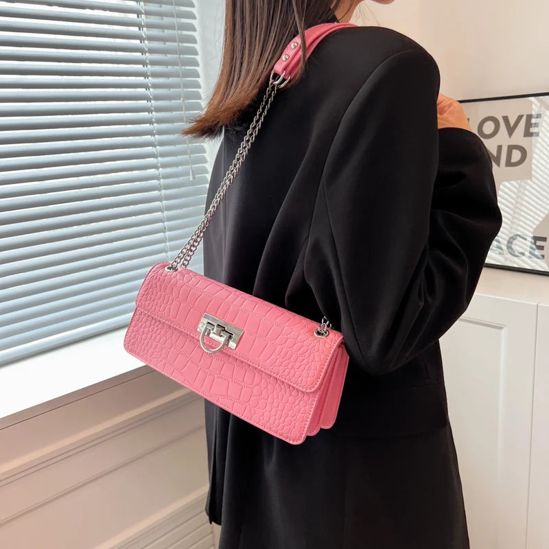 LunaStone mini shoulder bag with stone pattern and chain accents