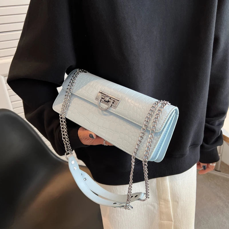 LunaStone mini shoulder bag with stone pattern and chain accents