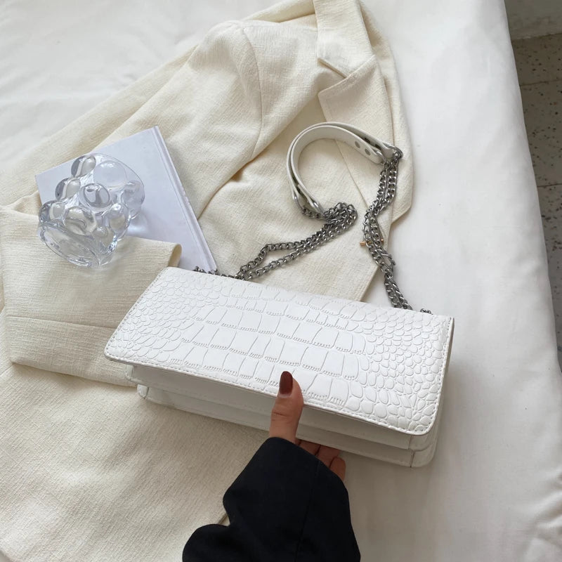 LunaStone mini shoulder bag with stone pattern and chain accents