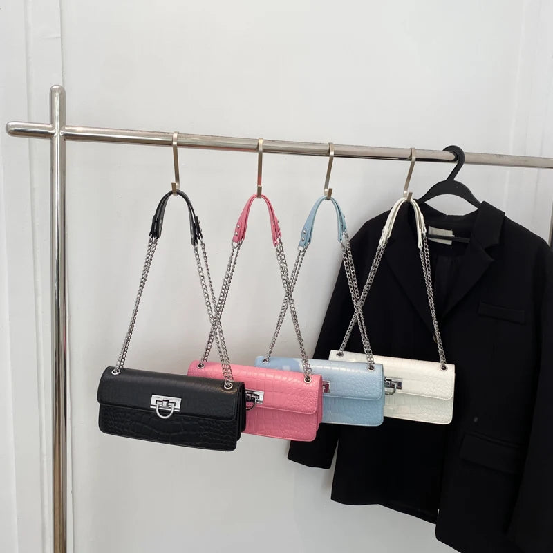 LunaStone mini shoulder bag with stone pattern and chain accents