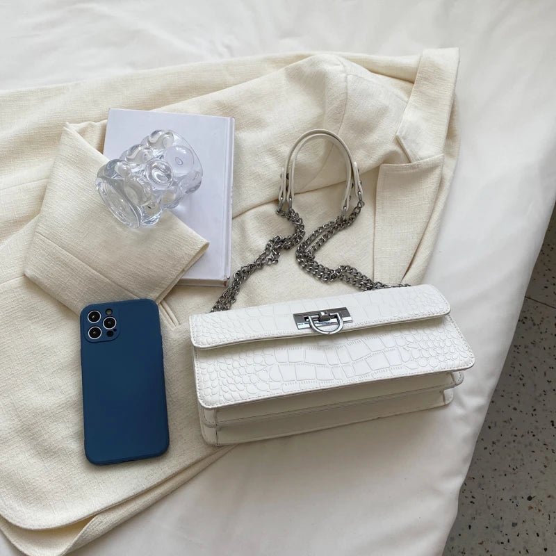 LunaStone mini shoulder bag with stone pattern and chain accents