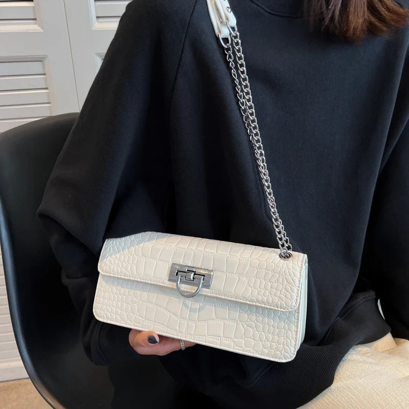 LunaStone mini shoulder bag with stone pattern and chain accents