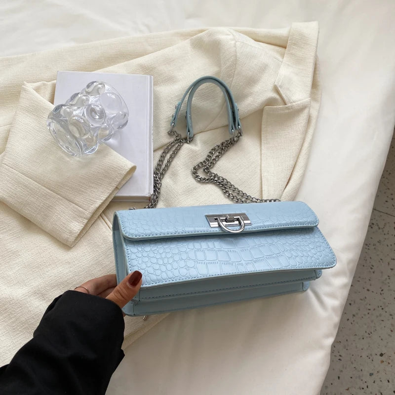 LunaStone mini shoulder bag with stone pattern and chain accents