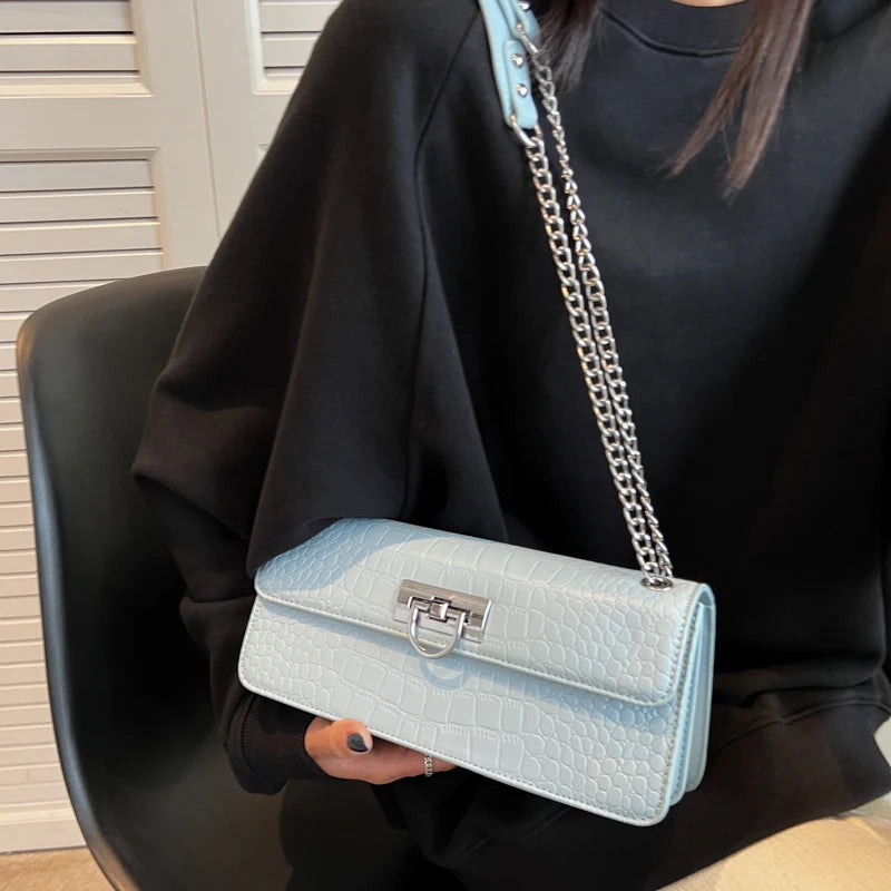 LunaStone mini shoulder bag with stone pattern and chain accents