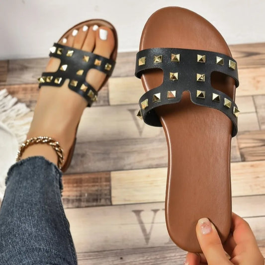 Woman wearing Rivessa slides on casual summer day