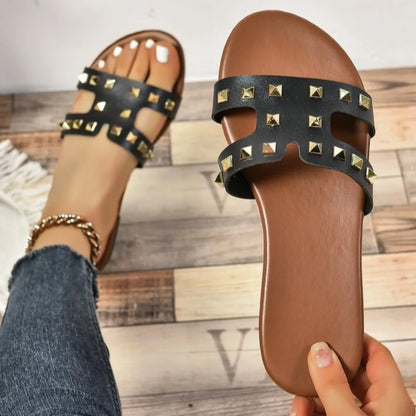 Woman wearing Rivessa slides on casual summer day